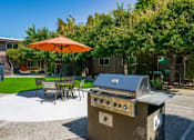 Thumbnail 11 of 25 - a gas grill on a patio with a table and umbrella at Element LLC, Sunnyvale, 94086