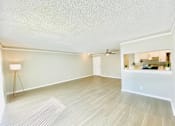 Thumbnail 15 of 31 - the spacious living room and kitchen of an apartment at The Flats on Addison, Sherman Oaks, CA