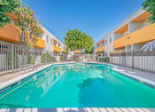 Thumbnail 4 of 31 - a swimming pool in front of an apartment building with a pool at The Flats on Addison, California, 91423