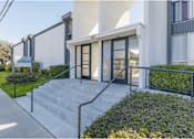 Thumbnail 4 of 39 - the front entrance of a building with stairs and glass doorsat The Arches Apartments, LLC, El Cajon, CA 92021