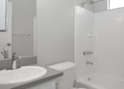 Thumbnail 13 of 19 - a white bathroom with a sink and a toilet  at The Marq Apartments LLC, Los Angeles