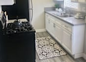Thumbnail 1 of 19 - a kitchen with a stove and a sink  at The Marq Apartments LLC, Los Angeles, California