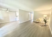 Thumbnail 18 of 18 - a living room with a hard wood floor and white walls at BLVD Apartments LLC, Tarzana