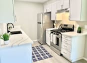 Thumbnail 13 of 18 - a kitchen with stainless steel appliances and a counter top at BLVD Apartments LLC, California, 91356