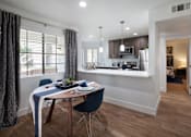 Thumbnail 18 of 44 - a kitchen and dining room with a table and chairsat The Bryant, Yorba Linda, CA 92887