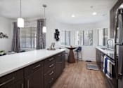 Thumbnail 9 of 44 - a kitchen with a sink and a refrigerator at The Bryant, Yorba Linda