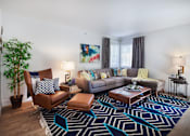 Thumbnail 11 of 44 - furnished living room with couches and chairs at the adelaideelaide apartmentsat The Bryant, Yorba Linda, 92887