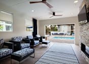 Thumbnail 19 of 44 - a living room with a fireplace and a poolat The Bryant, Yorba Linda, CA
