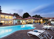 Thumbnail 8 of 44 - a swimming pool in front of a hotel at duskat The Bryant, Yorba Linda, CA