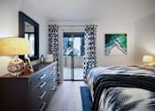 Thumbnail 13 of 44 - a bedroom with a bed and a door to a balcony at The Bryant, Yorba Linda California