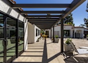 Thumbnail 27 of 27 - a patio with chairs and awnings in front of a building at La Jolla Blue, California, 92122