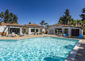 Thumbnail 3 of 27 - a swimming pool with a house in the background at La Jolla Blue, San Diego, CA 92122