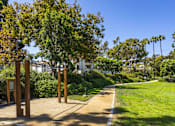 Thumbnail 22 of 27 - a path leading to a park with trees and grass at La Jolla Blue, California