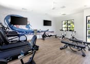 Thumbnail 8 of 27 - a gym with cardio equipment and a wall mural of the beach at La Jolla Blue, San Diego California