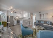Thumbnail 13 of 24 - a living room with couches and chairs and a kitchen with stainless steel appliances at Napa Green Apartments LLC, Napa, 94559