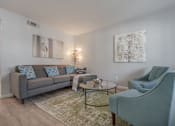 Thumbnail 14 of 24 - a living room with a couch and two chairs at Napa Green Apartments LLC, Napa