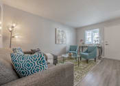Thumbnail 11 of 24 - a living room with a couch and chairs and a table at Napa Green Apartments LLC, California