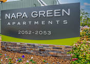 Thumbnail 6 of 24 - a sign for napa green apartments in front of a building at Napa Green Apartments LLC, Napa, CA 94559