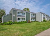 Thumbnail 8 of 24 - a row of green and white houses next to a sidewalk at Napa Green Apartments LLC, California, 94559