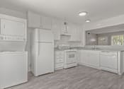 Thumbnail 25 of 45 - Kitchen with white appliances at Ocean Villas Apartments, California