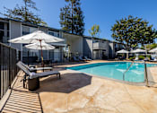 Thumbnail 4 of 32 - our apartments have a swimming pool and a patio with chairs and umbrellas at Campbell West Apartments, Campbell, 95008