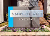 Thumbnail 6 of 32 - a sign that says apartments in front of flowers at Campbell West Apartments, California