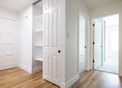 Thumbnail 21 of 83 - A white door with a shelf underneath it at Summerwood Apartment, Santa Clara, CA, 95050