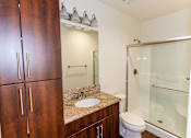 Thumbnail 36 of 45 - a bathroom with a sink and a shower and a toilet at The Vines at Riverpark, LLC, California, 93036