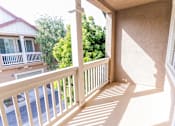 Thumbnail 35 of 45 - a balcony with a view of trees and a house at The Vines at Riverpark, LLC, California, 93036