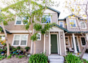 Thumbnail 37 of 45 - the front of a 2 story with a green door at The Vines at Riverpark, LLC, California, 93036