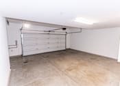 Thumbnail 31 of 45 - the inside of a garage with a white door at The Vines at Riverpark, LLC, California, 93036