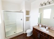 Thumbnail 29 of 45 - a bathroom with a shower and a sink and a toiletat The Vines at Riverpark, LLC, California, 93036