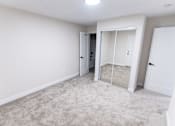 Thumbnail 24 of 31 - empty bedroom with a mirrored closet  at The Flats on Addison, Sherman Oaks