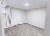Thumbnail 20 of 31 - an empty room with white walls and a white door at The Flats on Addison, Sherman Oaks, CA 91423