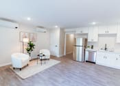 Thumbnail 23 of 31 -  living room with white cabinets and a kitchen at The Flats on Addison, Sherman Oaks, 91423
