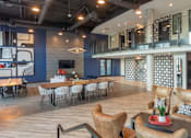 Thumbnail 25 of 78 - A modern room with a blue wall and a wooden floor.