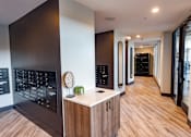 Thumbnail 21 of 78 - A modern kitchen with wooden floors and a black cabinet.
