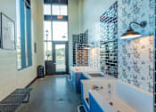 Thumbnail 13 of 78 - A bathroom with a blue and white tiled wall and a white sink.