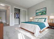Thumbnail 4 of 14 - A bedroom with a bed, a dresser, and a painting on the wall at The Pier at Sausalito, Sausalito