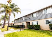 Thumbnail 5 of 5 - A building with the words "Royal Palm Apartments" on the front.
