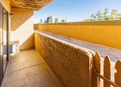 Thumbnail 7 of 9 - A sunny day at a modern house with a balcony.