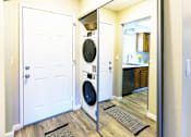 Thumbnail 3 of 9 - A white door is open to a kitchen.