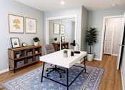 Thumbnail 3 of 8 - A room with a white table and a blue rug.