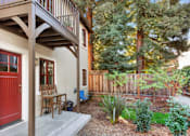 Thumbnail 9 of 10 - the front porch of a house with a red door
