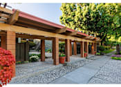 Thumbnail 10 of 10 - A building with a red roof and pillars with a sign that says 3400.