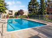 Thumbnail 7 of 8 - A small pool with a metal fence around it.