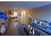 Thumbnail 1 of 9 - a living room with blue couches and a coffee table