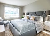 Thumbnail 1 of 9 - a bedroom with a large bed and a window