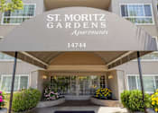Thumbnail 13 of 13 - The front entrance of the St. Moritz Gardens Apartments is shown.
