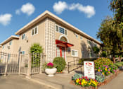 Thumbnail 1 of 8 - A building with a sign that says "Square" in front of it.